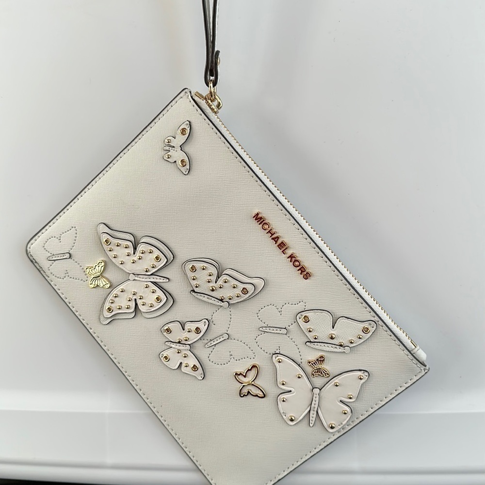 Michael Kors Butterfly appliqué studded XL clutch wristlet